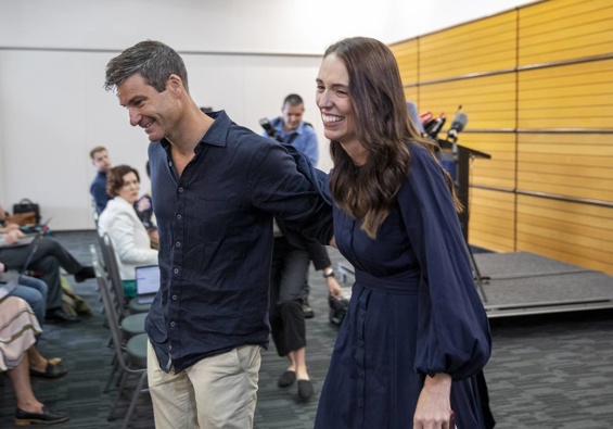 Jacinda Ardern with partner Clarke Gayford after she shock announcement that she is quitting as Prime Minister. Photo / Mark Mitchell
