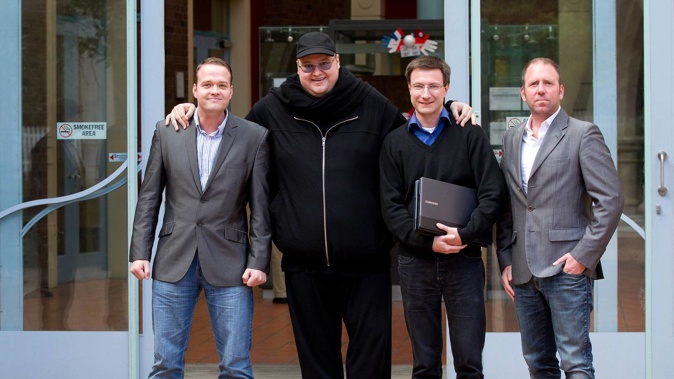Bram Van der Kolk, Kim Dotcom, Mathias Ortmann and Finn Batato outside the Auckland High Court in 2012. Photo / File