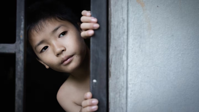 A 12-year-old boy was among the children adopted overseas, put to work in New Zealand and assaulted, despite his adopted "father" already having convictions for violence. Photo / 123rf