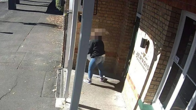 An unidentified woman was captured taking a box of premium oysters from Ponsonby's Jervois Steak House. Photo / Facebook