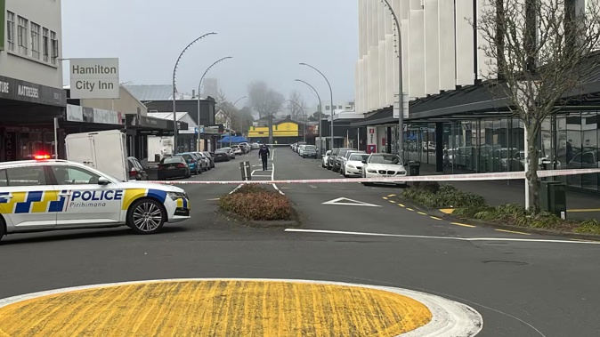 Police at the scene on Alexandra St in Hamilton after the man's death. Photo / RNZ / Daniel Gilhooly