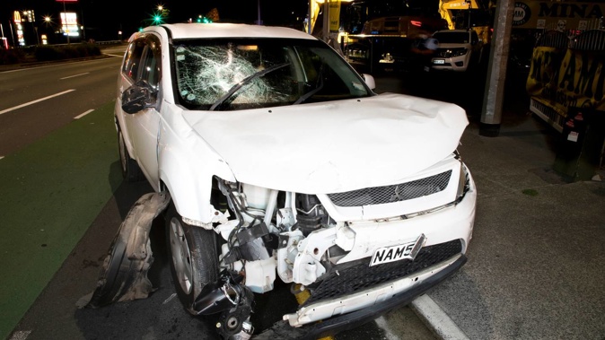 The entrance to Minami Motors on Panmure Highway in Mount Wellington was destroyed in a ram raid on Sunday evening with this vehicle used in the attack. (Photo / Hayden Woodward)