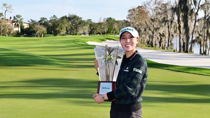 Lydia Ko of New Zealand poses with the trophy after winning the Hilton Grand Vacations Tournament of Champions. Photo / Getty