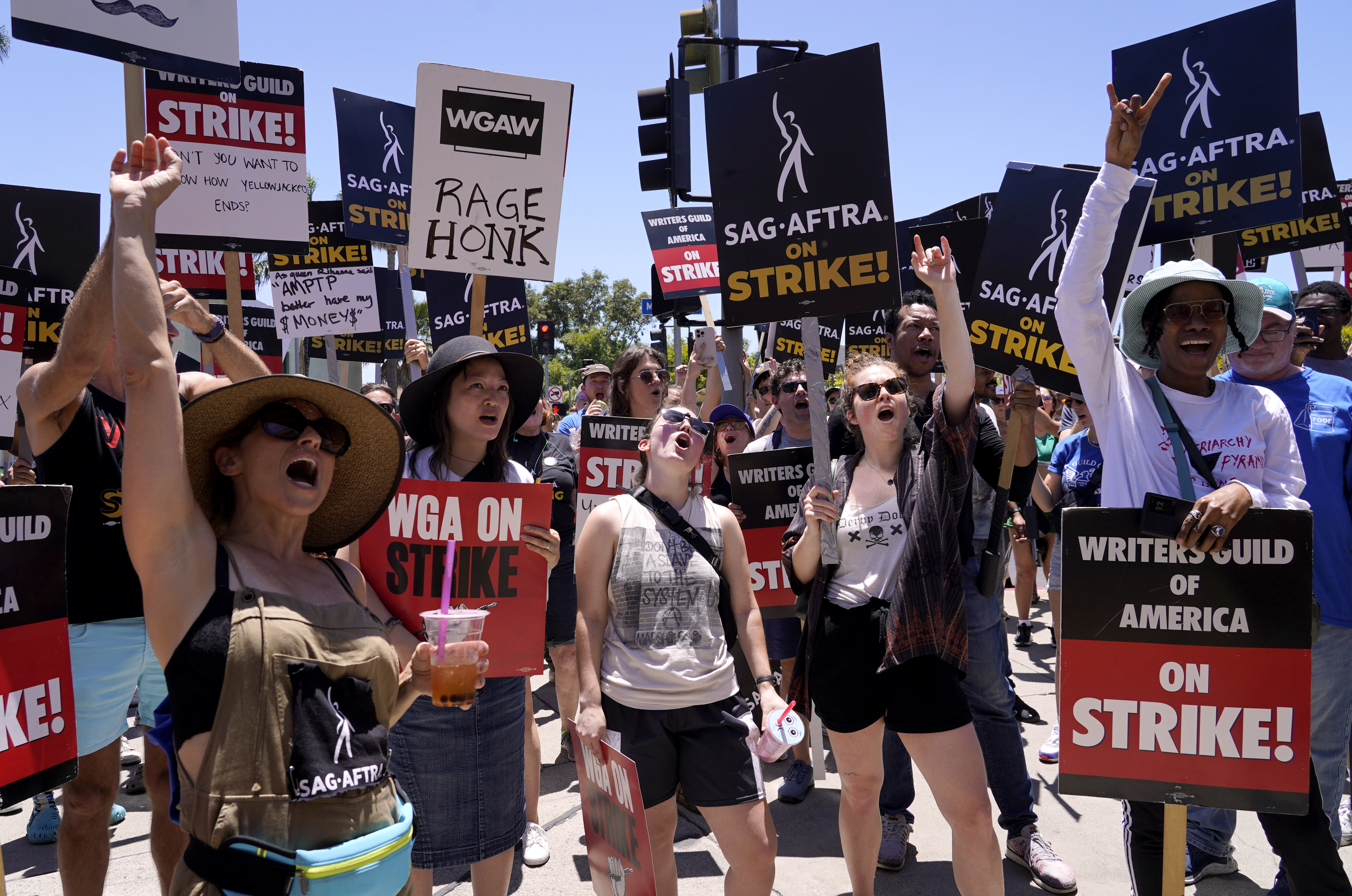 Striking writers and actors take part in a rally outside Paramount studios in Los Angeles on Friday, July 14, 2023. This marks the first day actors formally joined the picket lines, more than two months after screenwriters began striking in their bid to get better pay and working conditions. Photo / AP
