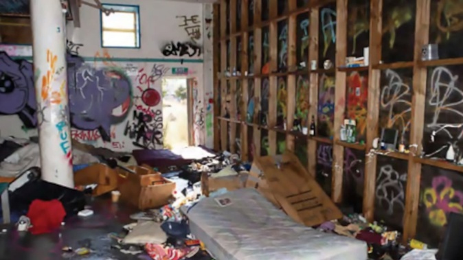 Photos taken following a fire in a derelict Wellington building reveal the grim reality of how squatters live. Photo / NZ Police