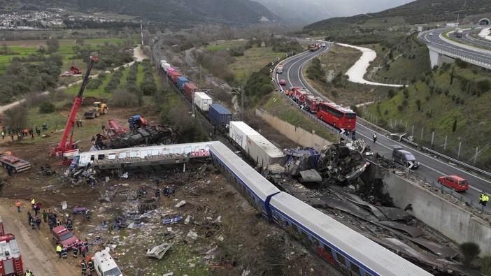 A crane, firefighters and rescuers operate after the collision in Tempe near Larissa city, Greece. Photo / AP