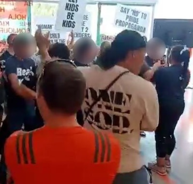 Destiny Church groups Man Up and Legacy Sisterhood protest against a children's library drag event at Te Atatū Community Centre.