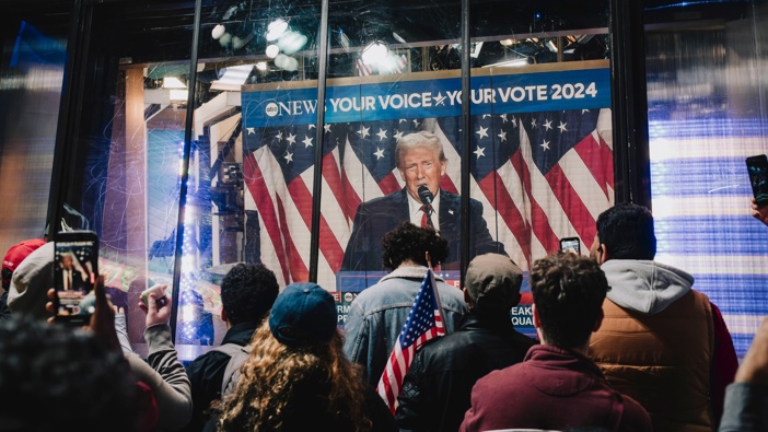 Onlookers watch a broadcast of former US President Donald Trump addressing his election night watch party, in Times Square in New York, US, on Wednesday, Nov. 6, 2024. Photo / Mark Abramson/Bloomberg via Getty Images