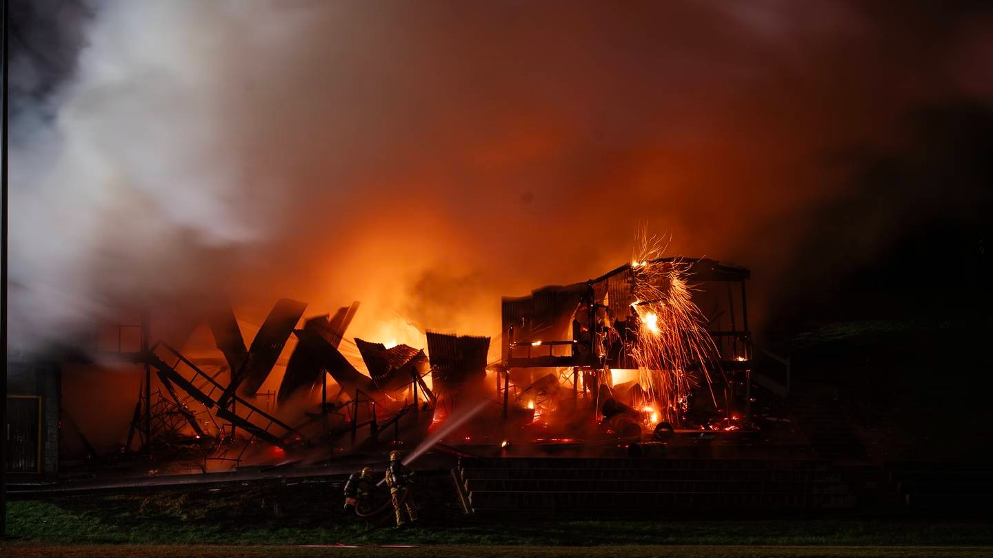 The two-storey Marist Saints Rugby League clubrooms in Mt Albert have collapsed after catching fire. Photo / Hayden Woodward
