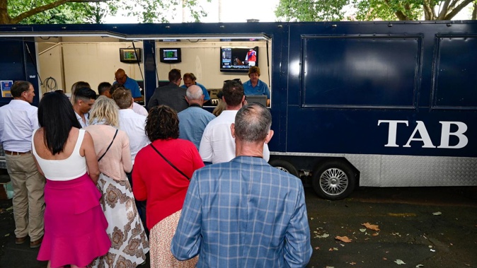 Punters line up to place bets at the TAB during the New Zealand Bloodstock Karaka Million at Ellerslie Racecourse, Auckland on Saturday 23rd January 2021. Copyright photo: Alan Lee / www.photosport.nz