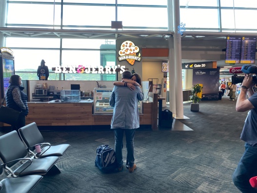 Emotional reunions at Wellington Airport as Aucklanders return. (Photo / Nick James)