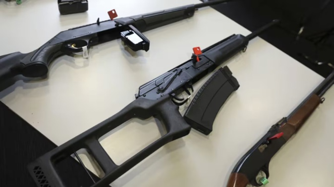 A selection of firearms which are now prohibited, on display to media at a 2022 police press conference. Photo / RNZ, Ana Tovey
