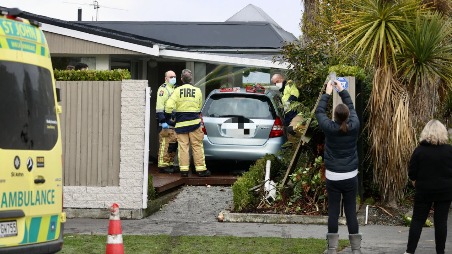 A vehicle has crashed into a house in Christchurch this morning. Photo / George Heard