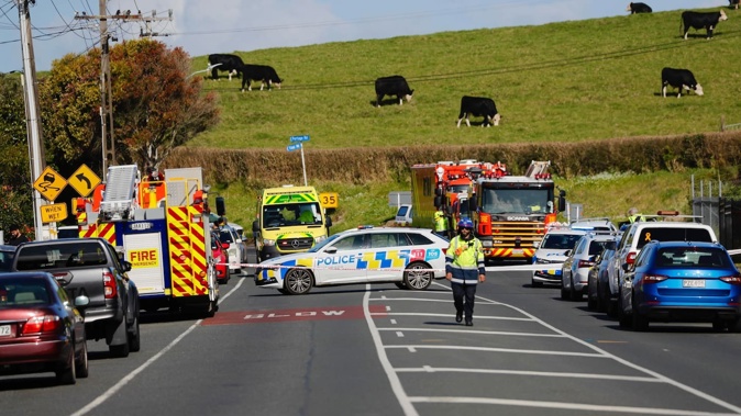 Police, firefighters and an ambulance responded to a 'well-involved' house fire in Tidal Rd, Māngere. Photo / Dean Purcell