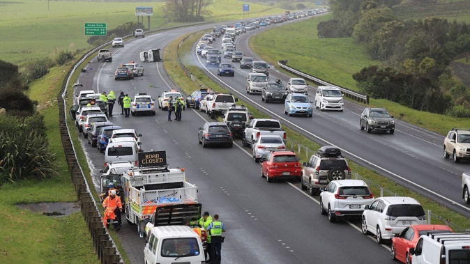 Police closed the Northern Motorway south of Silverdale after a two-car crash. Photo / Hayden Woodward