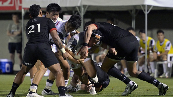 Koga Nezuka of Japan is tackled during the Lipovitan D Challenge Cup match between Japan XV and Maori All Blacks at Prince Chichibu Memorial Rugby Ground on June 29, 2024 in Tokyo, Japan. (Photo by Koki Nagahama/Getty Images)