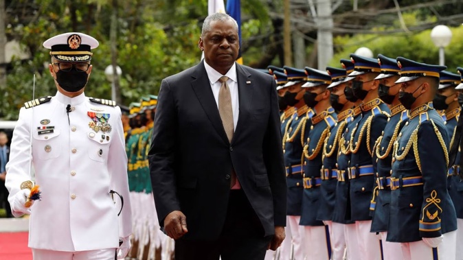 US Defence Secretary Lloyd Austin, second from left, walks past military guards during his arrival at the Department of National Defence in Camp Aguinaldo military camp in Quezon City, Metro Manila, Philippines on Thursday. Photo / via AP