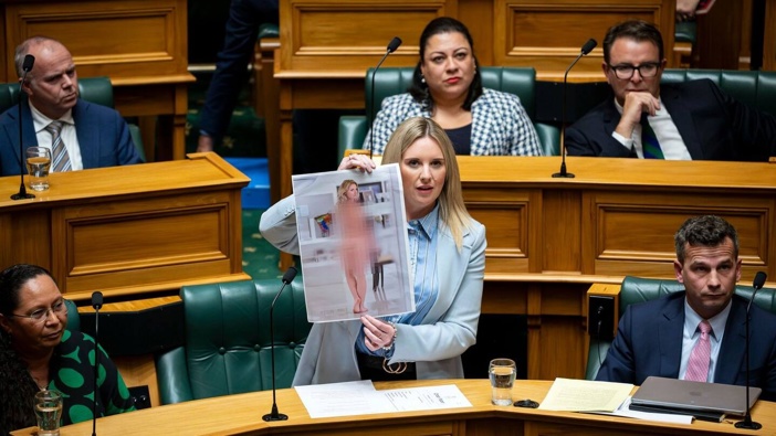 Act MP Laura McClure shows an AI-generated deepfake nude photo of herself in the House. Photo / Supplied