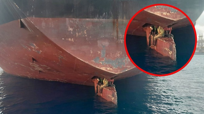 Three men are photographed on the Alithini II oil tanker anchored in the port of the Canary Islands, Spain. after the vessel sailed there from Nigeria. Photo / Salvamento Maritimo via AP