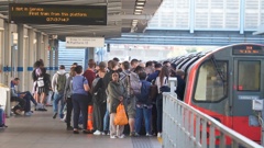 Passengers board a tube at Stratford station, as train services continue to be disrupted following the nationwide strike by members of the Rail, Maritime and Transport union along with London Underground workers in a bitter dispute over pay, jobs and conditions, in London, Wednesday June 22, 2022. (Photo / AP)