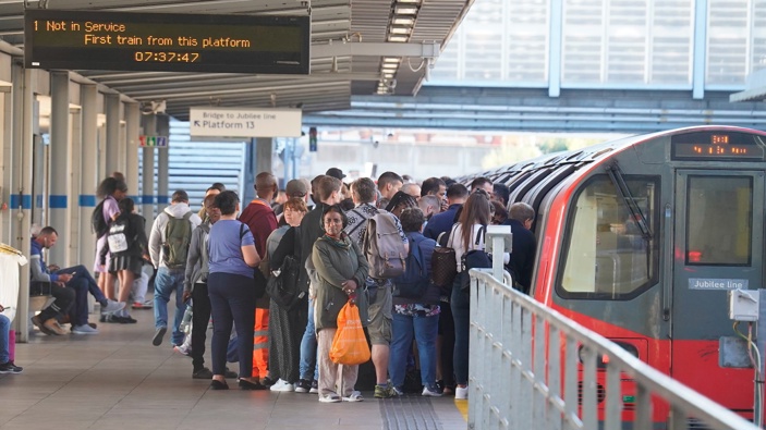 Passengers board a tube at Stratford station, as train services continue to be disrupted following the nationwide strike by members of the Rail, Maritime and Transport union along with London Underground workers in a bitter dispute over pay, jobs and conditions, in London, Wednesday June 22, 2022. (Photo / AP)