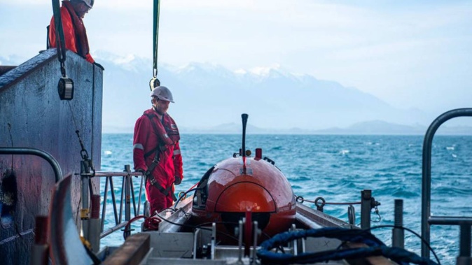 Barry Fleming (NIWA) and Mark Symons (MMT) with the Hugins AUV on board the RV Tangaroa for the Kaikōura seabed study. Photo / Lana Young