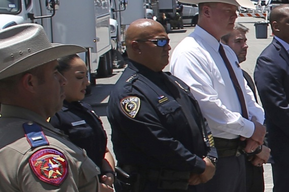Uvalde School Police Chief Pete Arredondo, third from left, stands during a news conference outside of the Robb Elementary school in Uvalde, Texas.