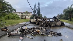 Burnt out cars in New Caledonia during civil unrest. Photo: Twitter / @ncla1ere
