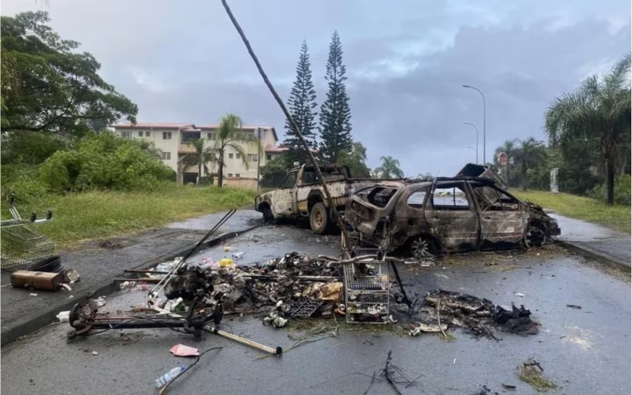 Burnt out cars in New Caledonia during civil unrest. Photo: Twitter / @ncla1ere