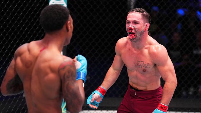 Aaron Tau (right) was beaten by unanimous decision by Elijah Smith on Dana White's Contender Series. Photo / Getty Images