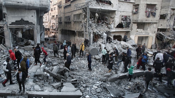 Palestinians inspect the damage at the site of an Israeli airstrike in the Nuseirat camp in central Gaza on November 27, 2024 amid the ongoing war in the Palestinian territory between Israel and Hamas. Photo / AFP