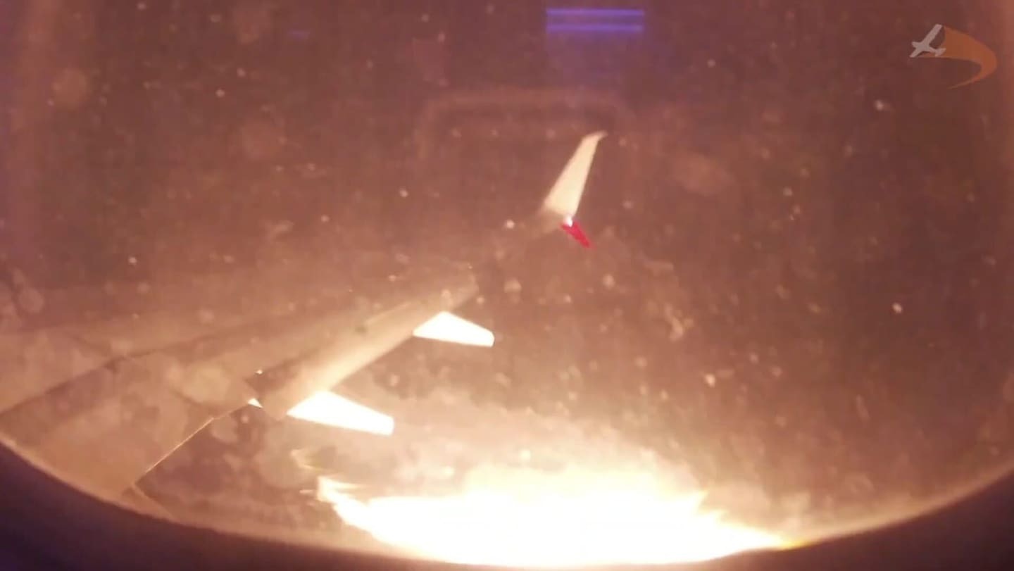 Flames engulfed an engine on a Virgin Airlines flight bound for Melbourne. Photo / Michael Hayward