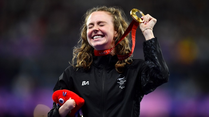 Gold medalist Anna Grimaldi of Team New Zealand reacts during the medal presentation for the Women's 200m - T47 Final on day ten of the Paris 2024 Summer Paralympic Games at Stade de France on September 07, 2024 in Paris, France. (Photo by Franco Arland/Getty Images for IPC)