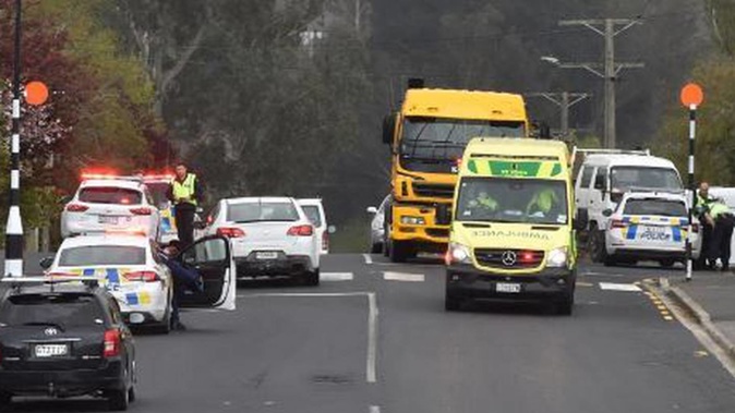 Emergency services at the scene where a pedestrian was hit by a truck in Dunedin yesterday. Photo / Gregor Richardson