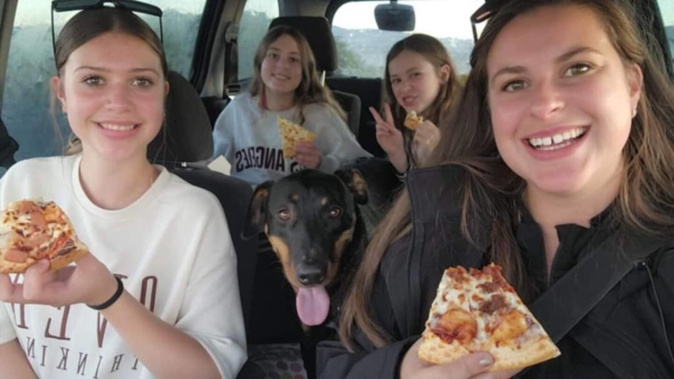 Krystal Brens and her three girls have been living out of their suitcases since their Dunedin home was red-stickered in the floods. Photo / Supplied