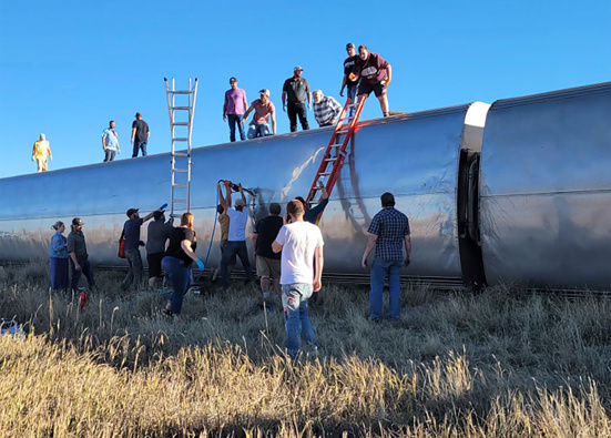 People work at the scene of an Amtrak train derailment on September 25 in Montana. (Photo / AP)