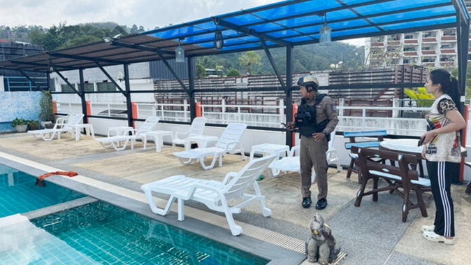 The couple were seen arguing at this hotel pool shortly before the woman became unconscious. Photo / Supplied
