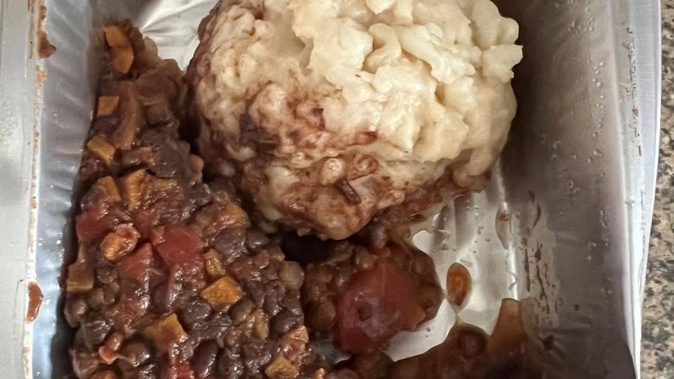 A school lunch described as "unidentifiable pasta ball and lentils".