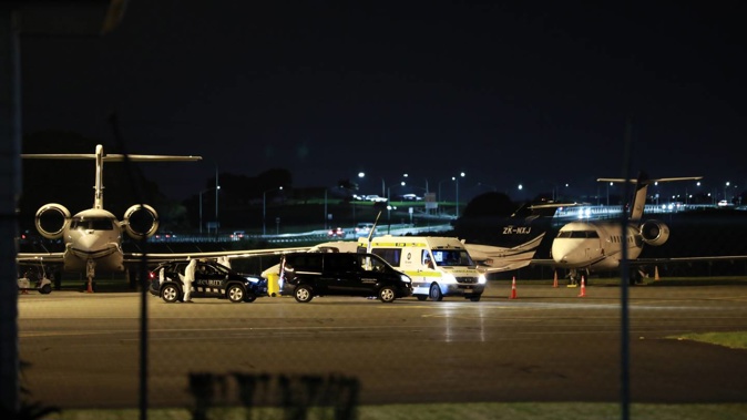 A plane believed to be carrying a Covid-19 positive person from Fiji arrived at Auckland Airport on Thursday evening. (Photo / Hayden Woodward)