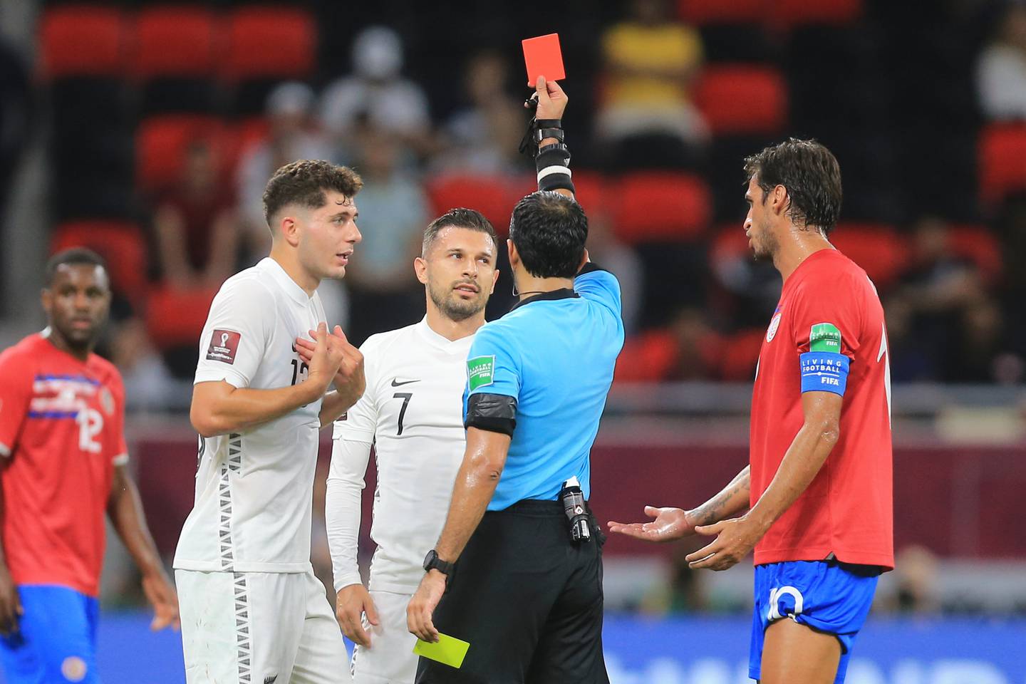 New Zealand's Kosta Barbarouses, centre, gets a red card. (Photo / AP)