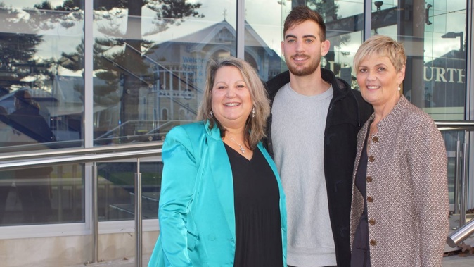 Paula Palmer (left), her son Brook Palmer and family support person Tracy Manning outside the Nelson District Court today. Photo / Tracy Neal
