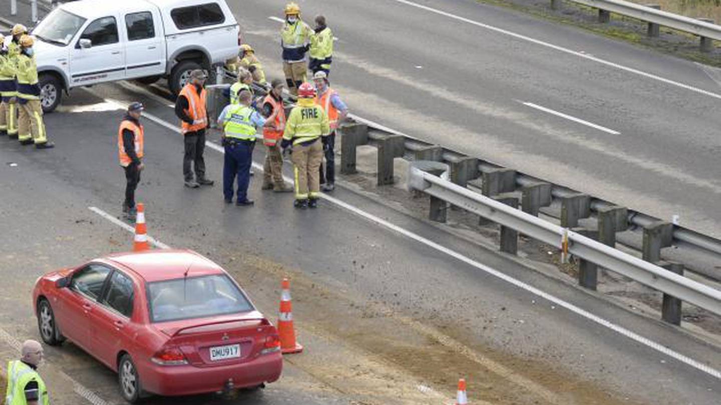 Contractors and emergency services at the crash scene yesterday. Photo / Gerard O'Brien