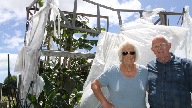 Robyn and Michael French in front of the tropical house damaged when a tornado swept through their property. Photo/ Stuart Whitaker
