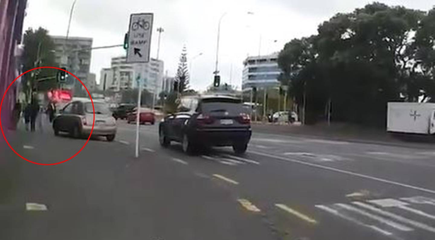 This is the moment a driver came close to hitting a young child while driving on the footpath in Auckland. Photo / Supplied