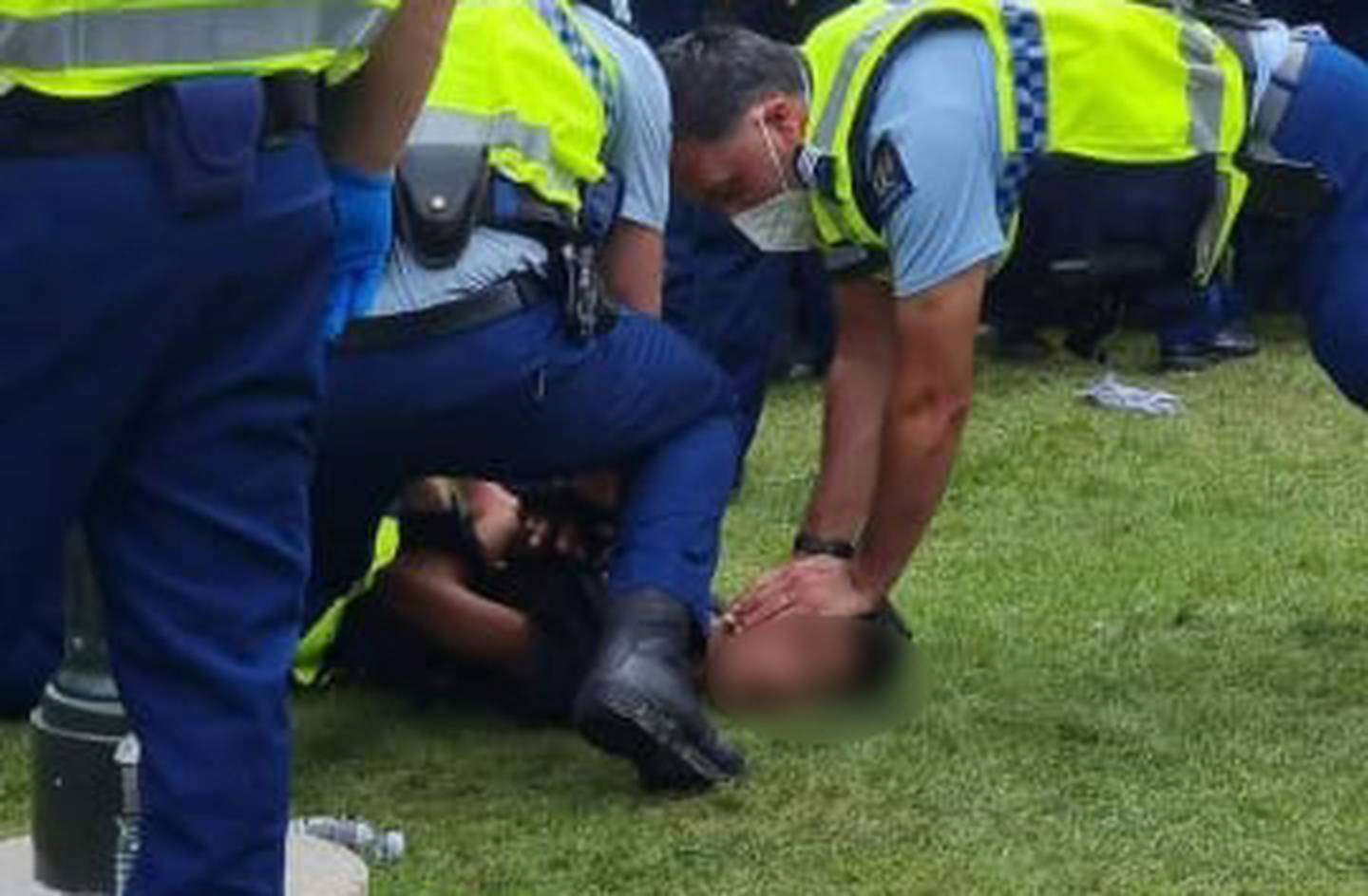 A police officer was filmed holding the boy's head down during arrest. (Photo / Supplied)