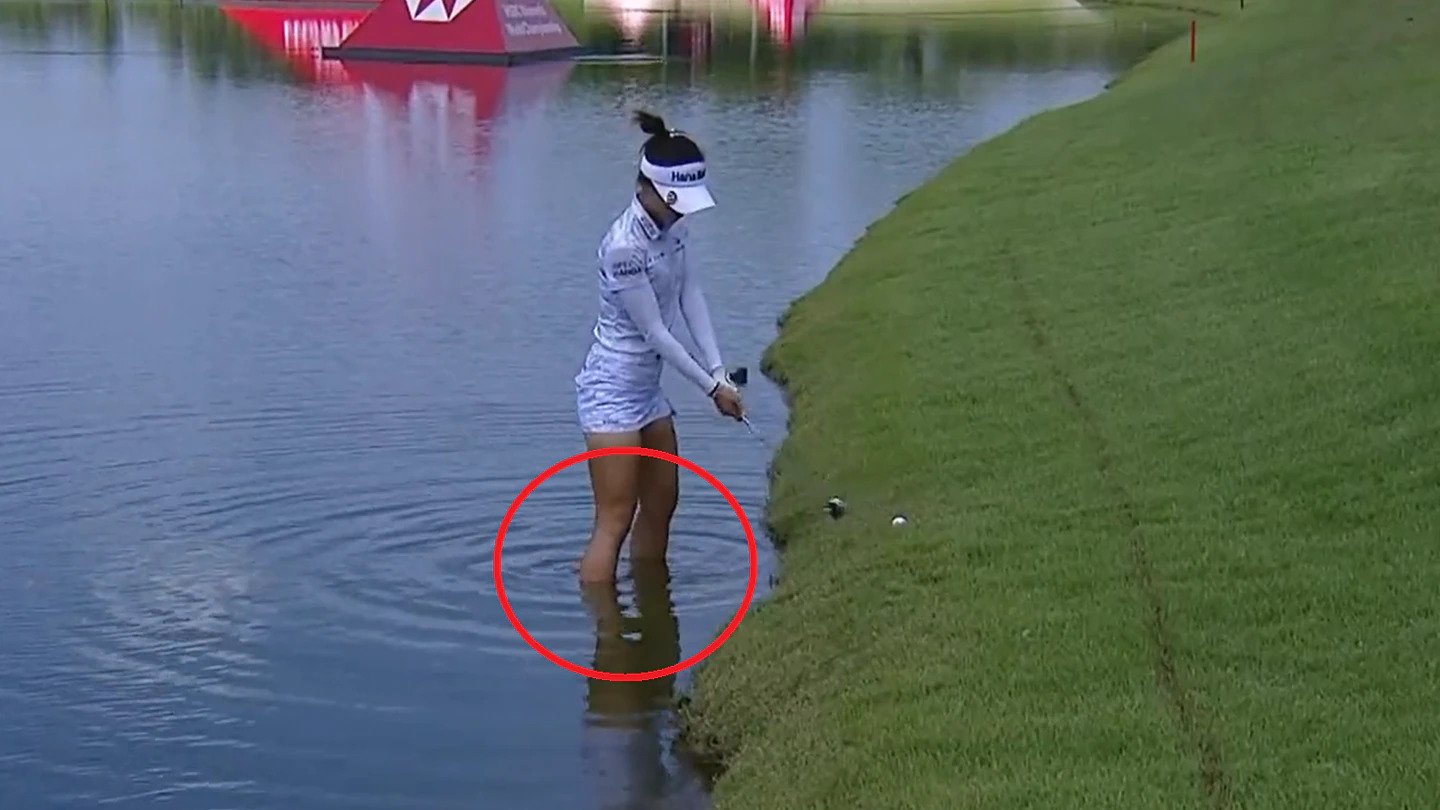 No golf shoes, no problem for Lydia Ko as she nails a shot from the water. Photo / Twitter/LPGA Tour