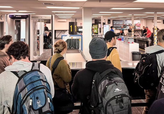 Water pours through the ceiling on to electronic equipment at Auckland Airport's domestic terminal.