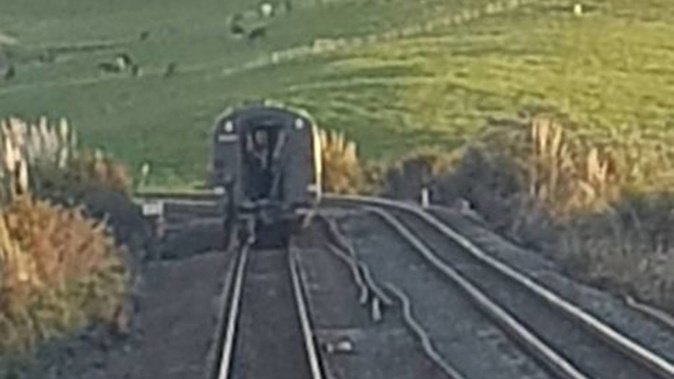 The back two carriages of the Te Huia train were left about 500 metres down the track from the rest of the train after breaking away just 10 minutes into the journey. Photo / Kiley O'Meara