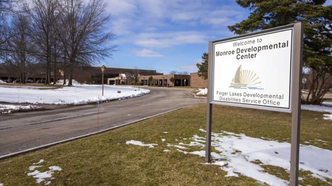 A sign for the Monroe Developmental Center at the Finger Lakes Developmental Disabilities Service Office. Photo / AP