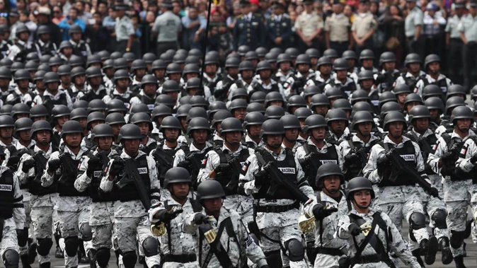 Members of Mexico's National Guard march in the Independence Day military parade, in the capital's main plaza, the Zocalo, in Mexico City. Photo / AP